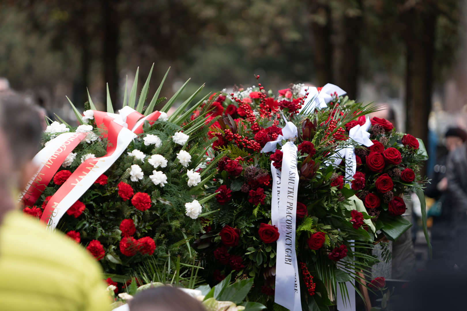 Wreaths with ribbons at the graveside