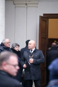 The celebrant at the entrance to a chapel